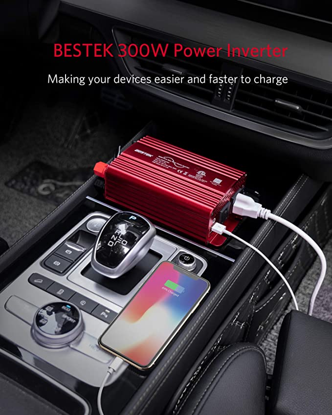 BESTEK 300W pure sine wave inverter — red inverter charging a phone on a car console