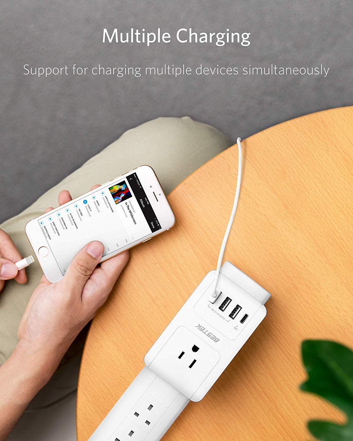 BESTEK travel plug adapter — adapter charging devices on a desk