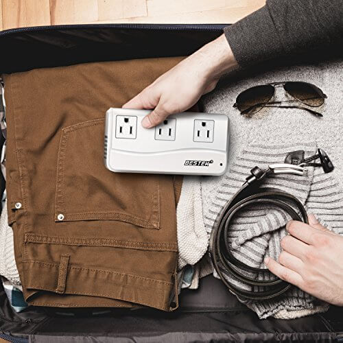 BESTEK 250W travel voltage converter — white converter being packed into a suitcase