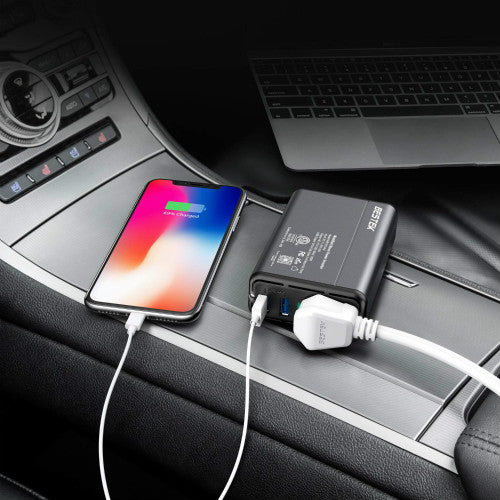 BESTEK 150W inverter — inverter charging phones on a car console